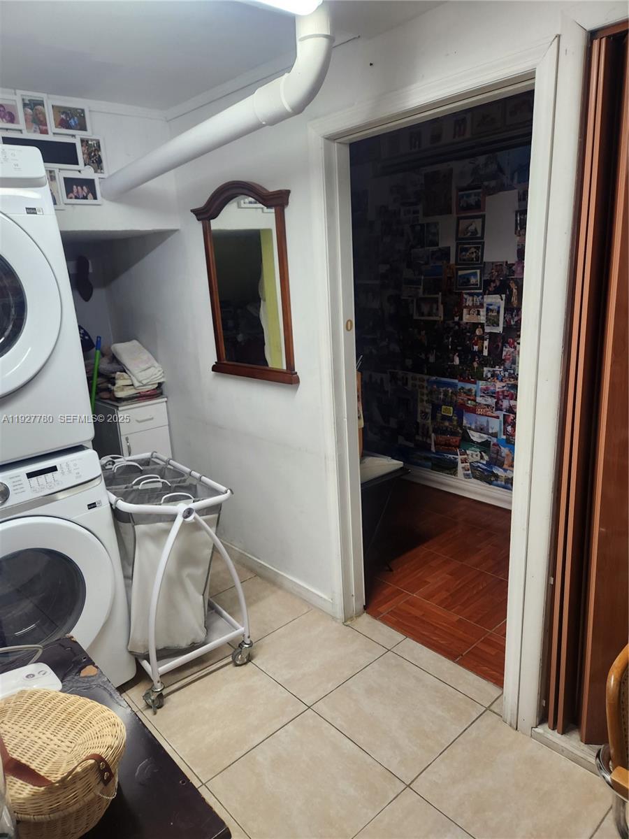 1645 Southwest 83rd Ct. Miami, FL 33155 - Photo 40 of 45 a utility room with sink dryer and washer