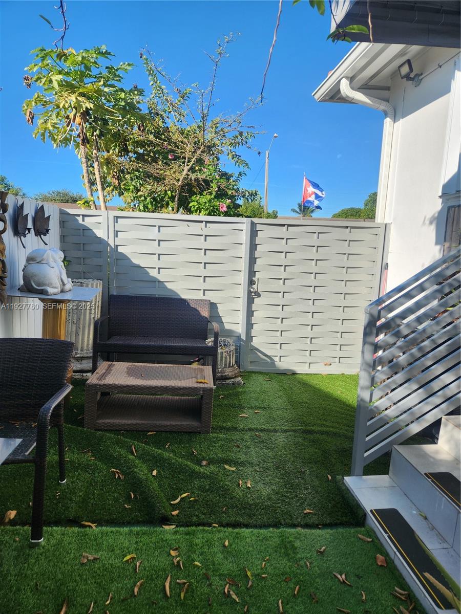 1645 Southwest 83rd Ct. Miami, FL 33155 - Photo 41 of 45 a view of a backyard with plants and a garden