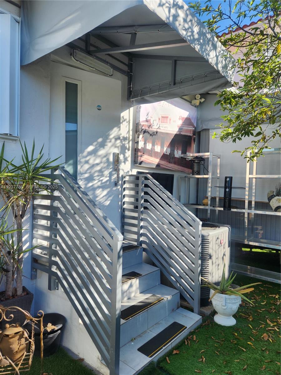 1645 Southwest 83rd Ct. Miami, FL 33155 - Photo 42 of 45 a view of a house with a yard