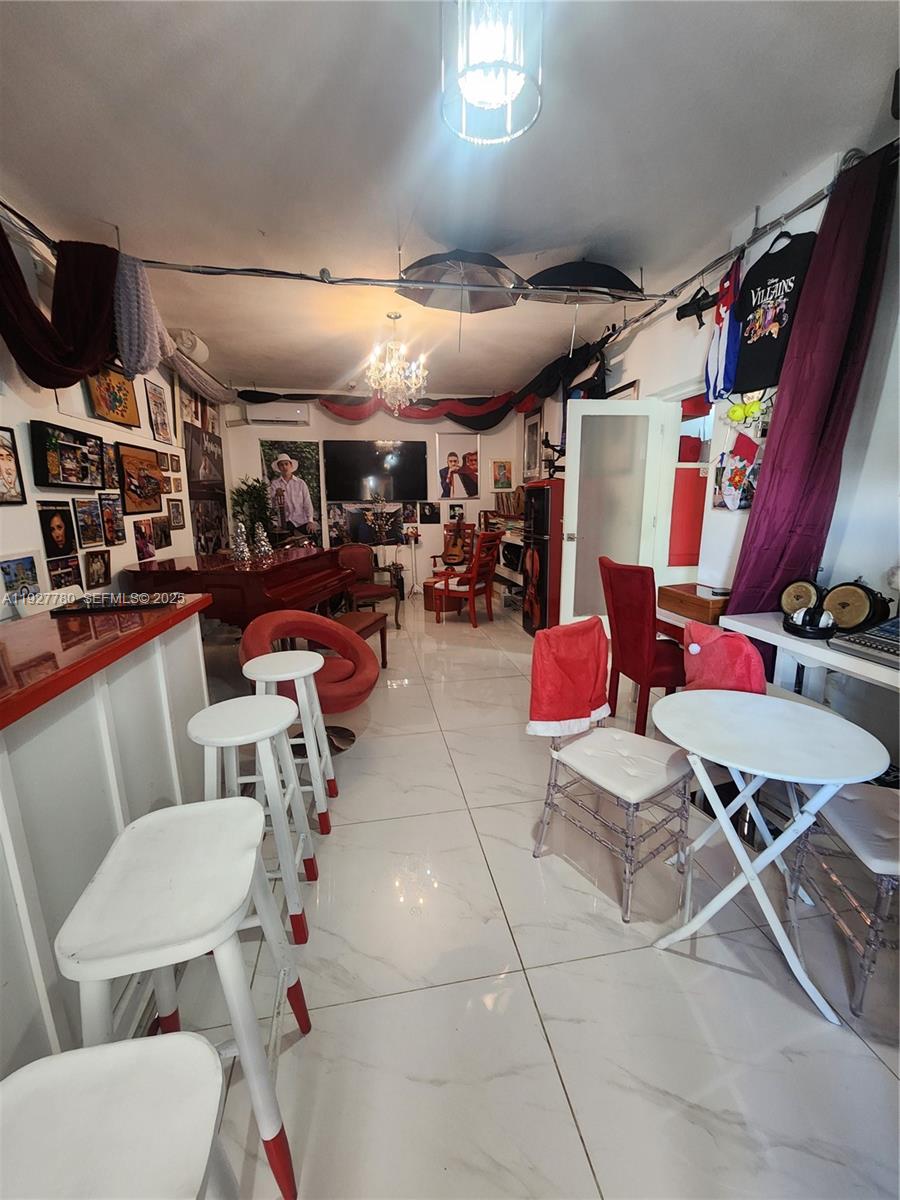 1645 Southwest 83rd Ct. Miami, FL 33155 - Photo 8 of 45 a room with gym equipment and a view of living room