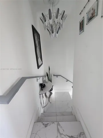 a bedroom with furniture and a potted plant