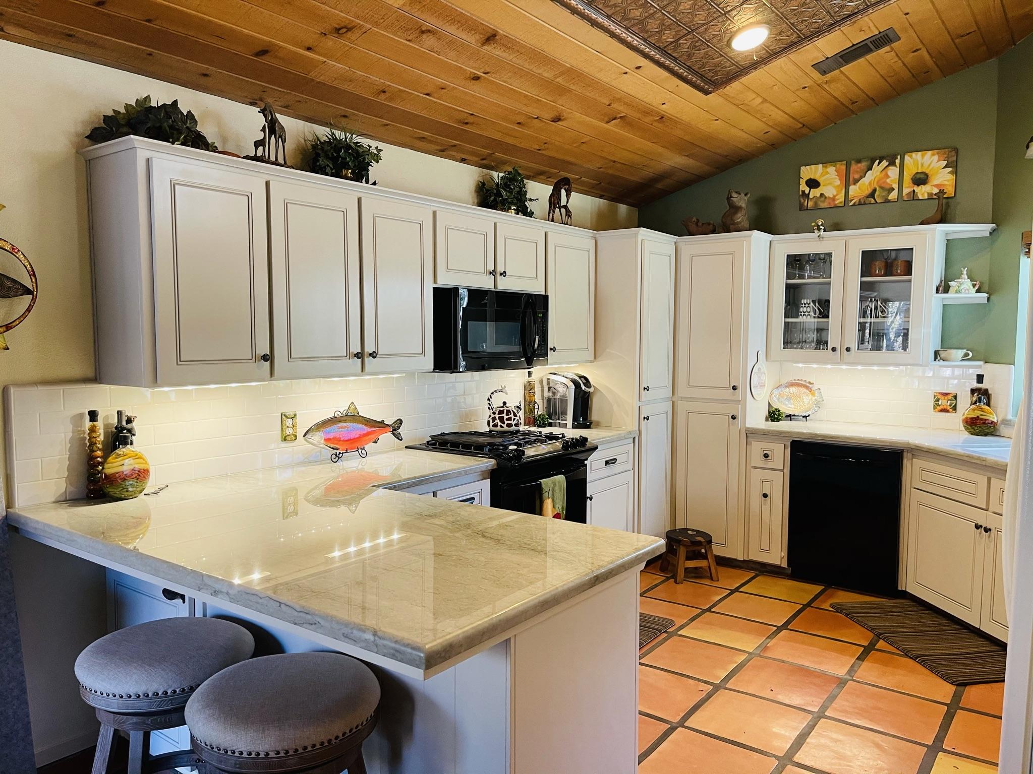 40964 Cherokee Oaks Drive Three Rivers, CA 93271 - Photo 5 of 41 a kitchen with a sink cabinets and wooden floor