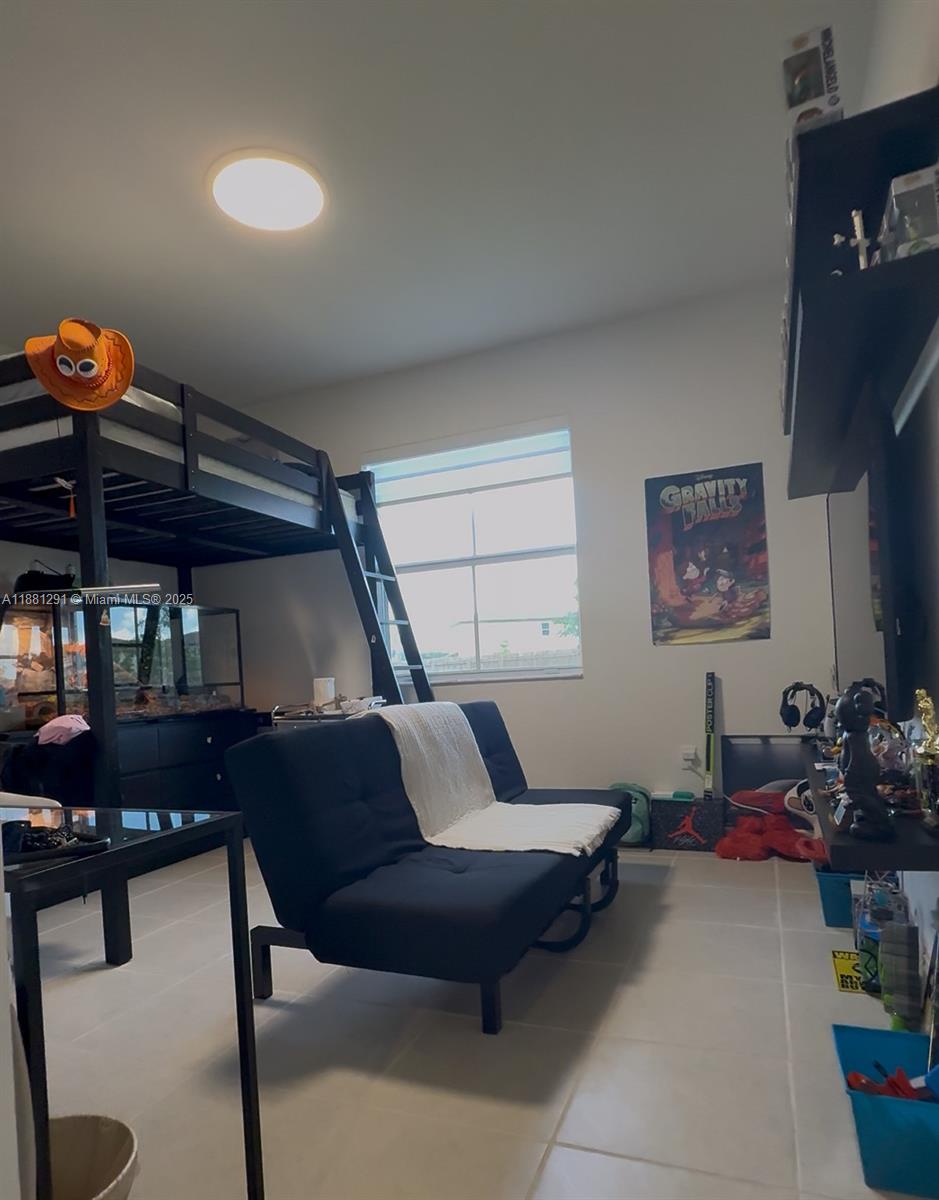 2415 Southeast 23rd Road Homestead, FL 33035 - Photo 5 of 6 a living room with furniture and wooden floor