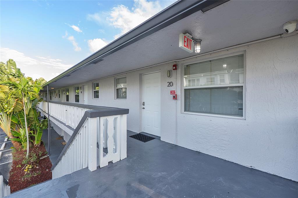 2741 Northeast 8th Avenue, Unit 20 Wilton Manors, FL 33334 - Photo 14 of 25 a view of a house with a garage