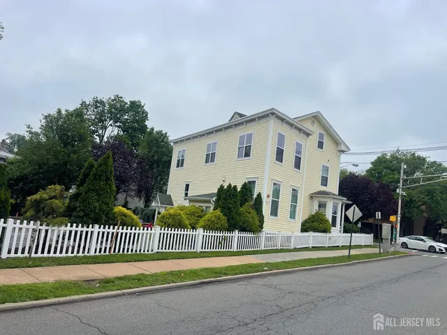 a view of a house with a iron gate