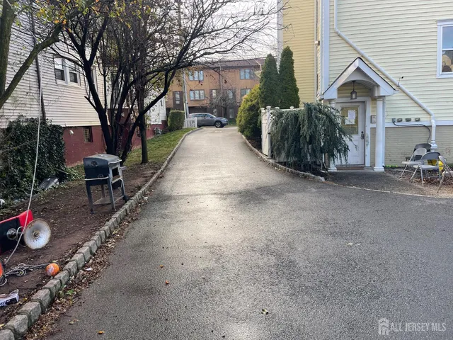 a view of a chairs and table in the backyard