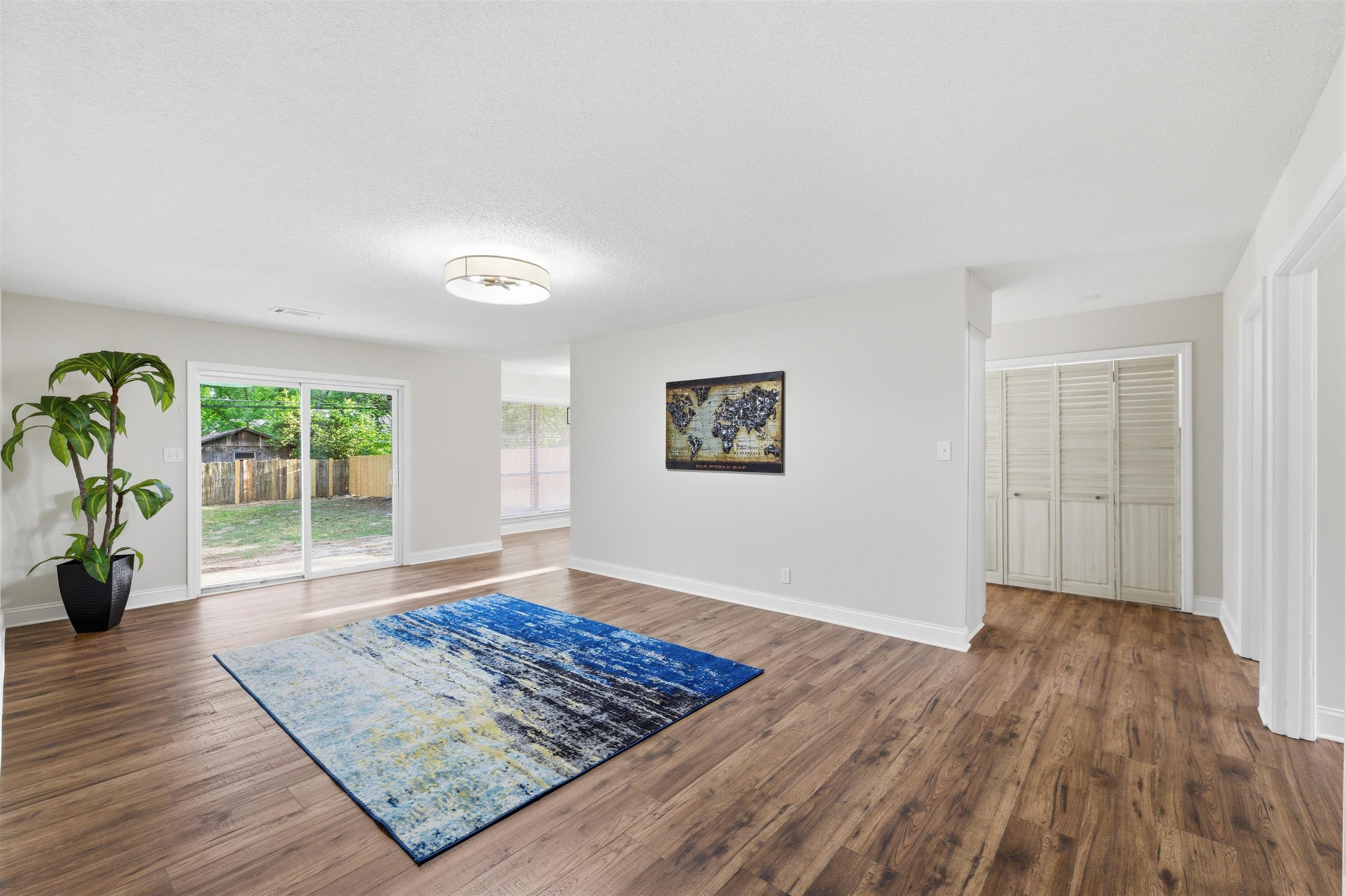 5333 Mesquite Road Memphis, TN 38120 - Photo 8 of 20 Spacious interior featuring wood-finish flooring, light gray walls, and white trim