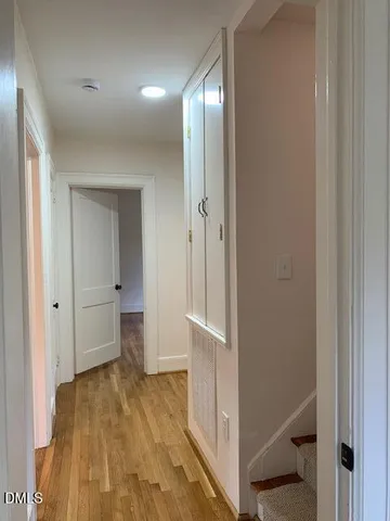 a bathroom with a toilet a sink and a window