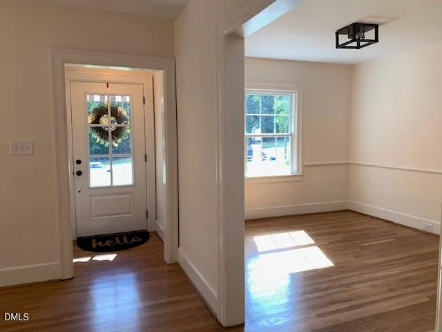 a view of an empty room with a window