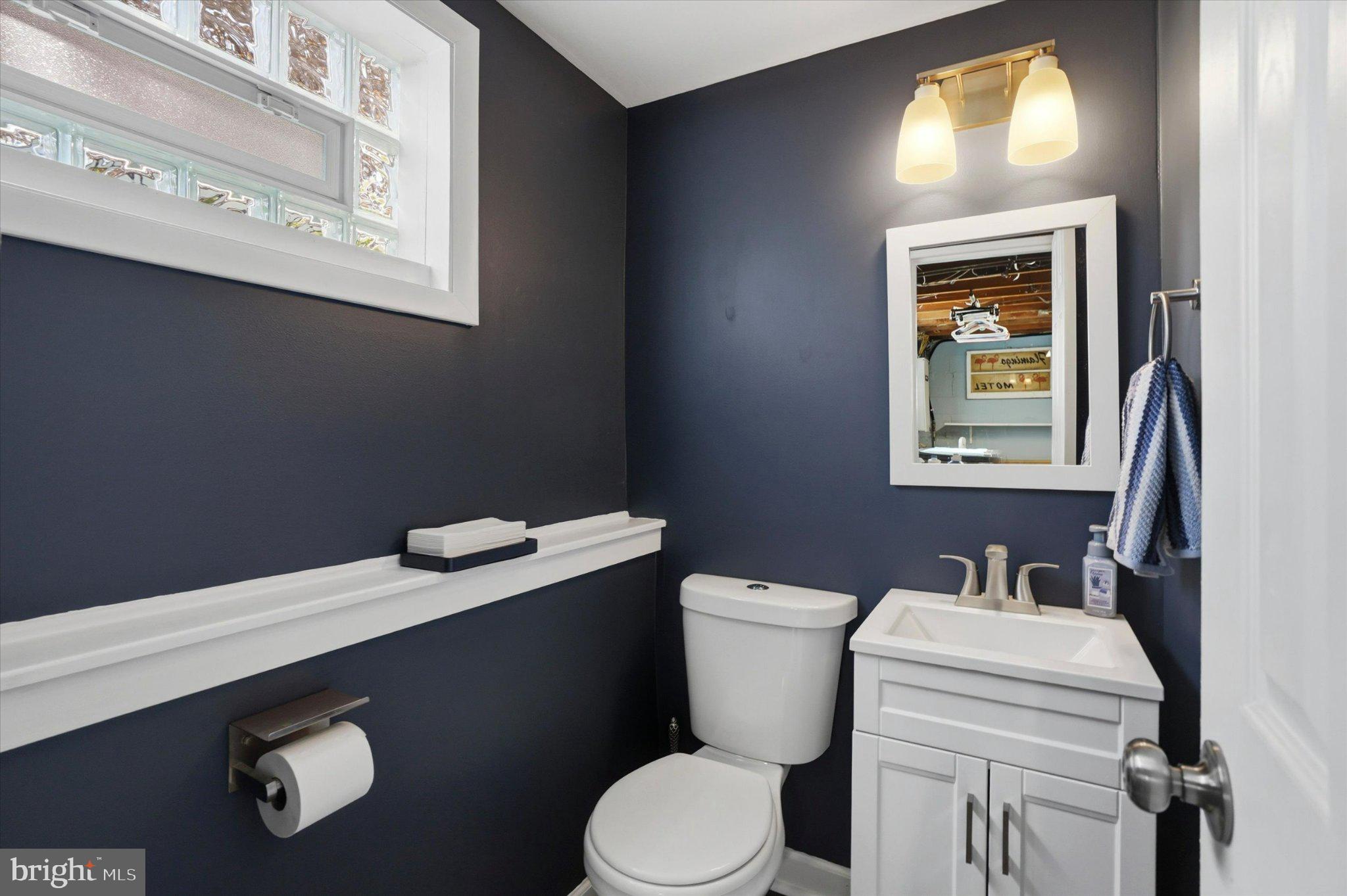 308 Lewis Road Springfield, PA 19064 - Photo 25 of 34 Chic navy bathroom with modern accents.