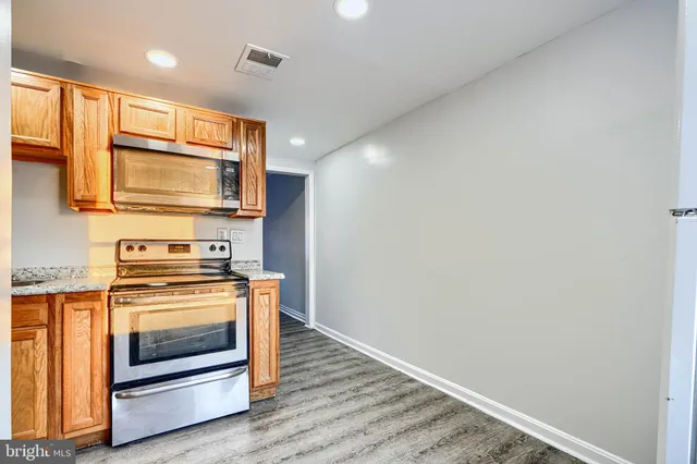 a kitchen with a stove and a microwave