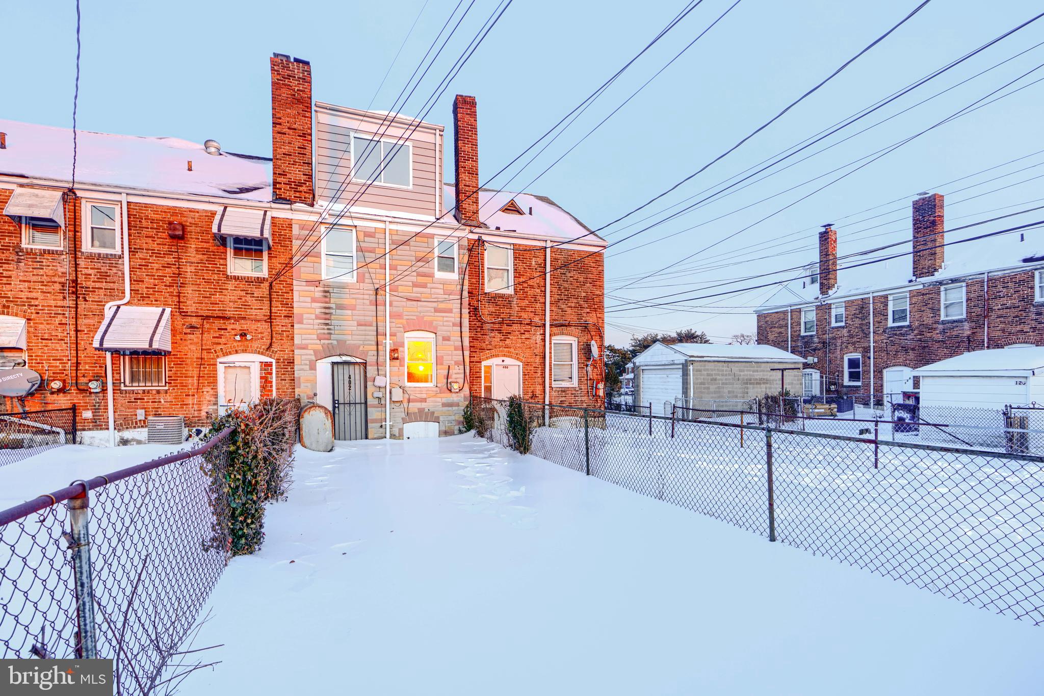 402 Chestnut Court Dundalk, MD 21222 - Photo 16 of 36 a front view of a building with glass windows