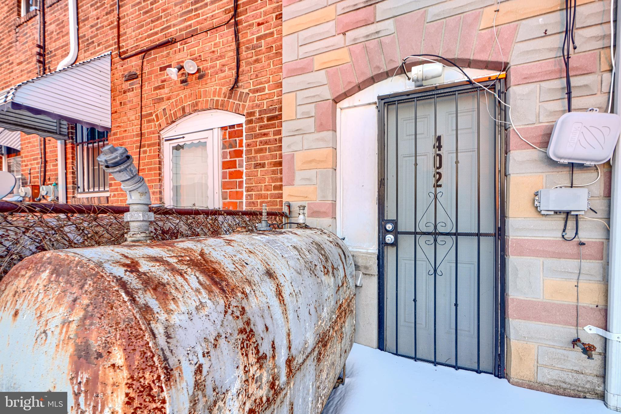 402 Chestnut Court Dundalk, MD 21222 - Photo 19 of 36 a front view of a house with wooden fence