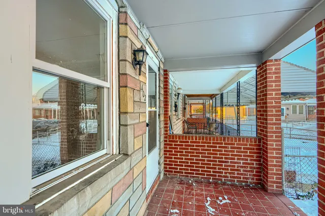 a view of a brick house with a large window