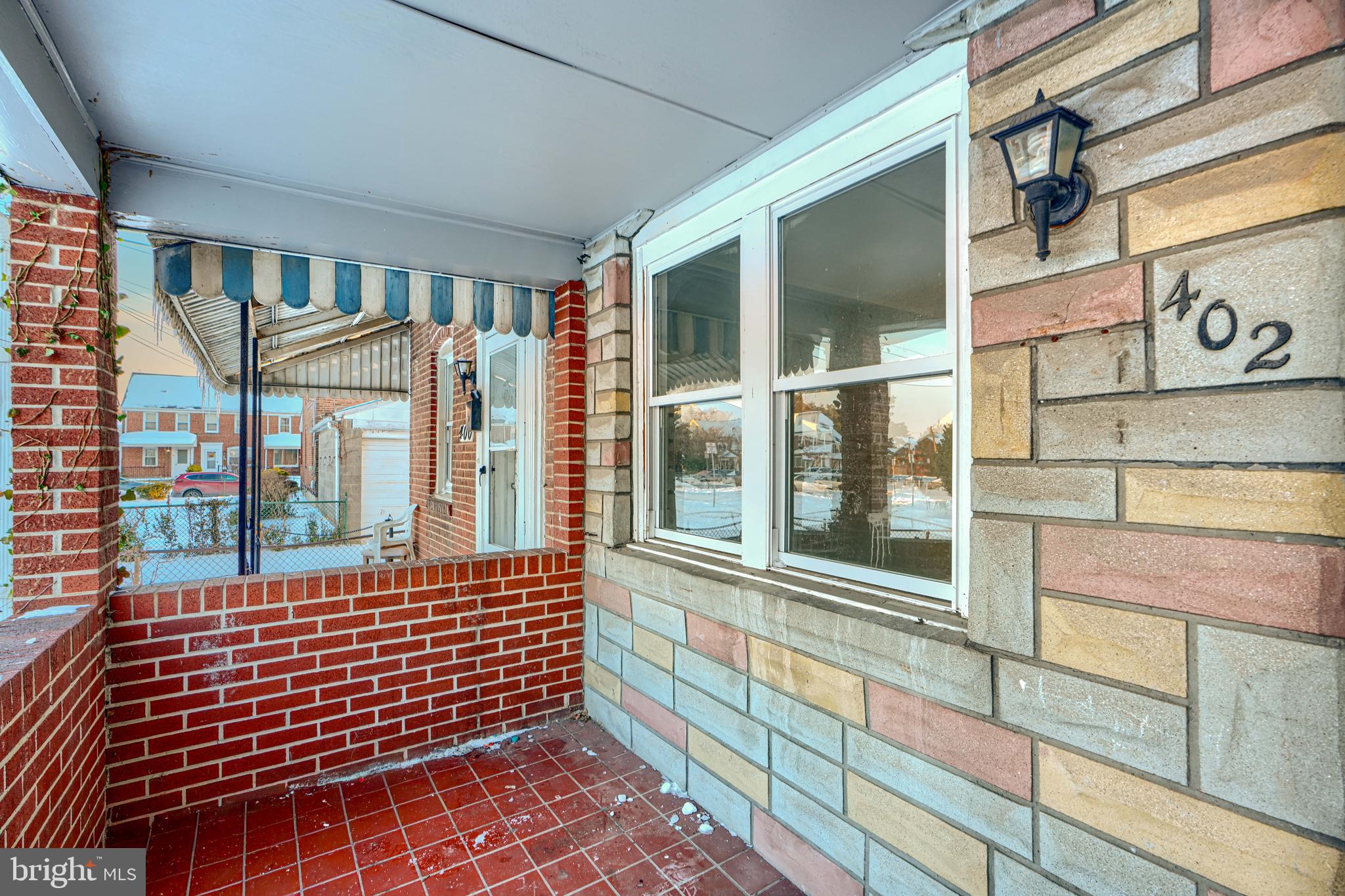 402 Chestnut Court Dundalk, MD 21222 - Photo 3 of 36 a view of a brick house with a large window