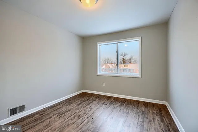 a view of a brick building with many windows