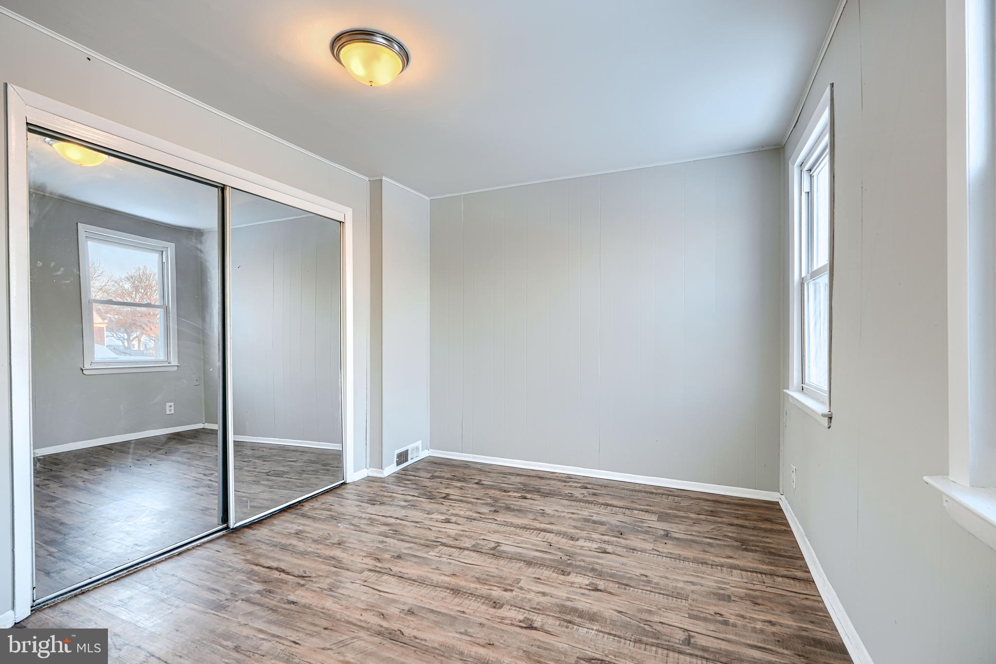 402 Chestnut Court Dundalk, MD 21222 - Photo 9 of 36 a view of empty room with wooden floor