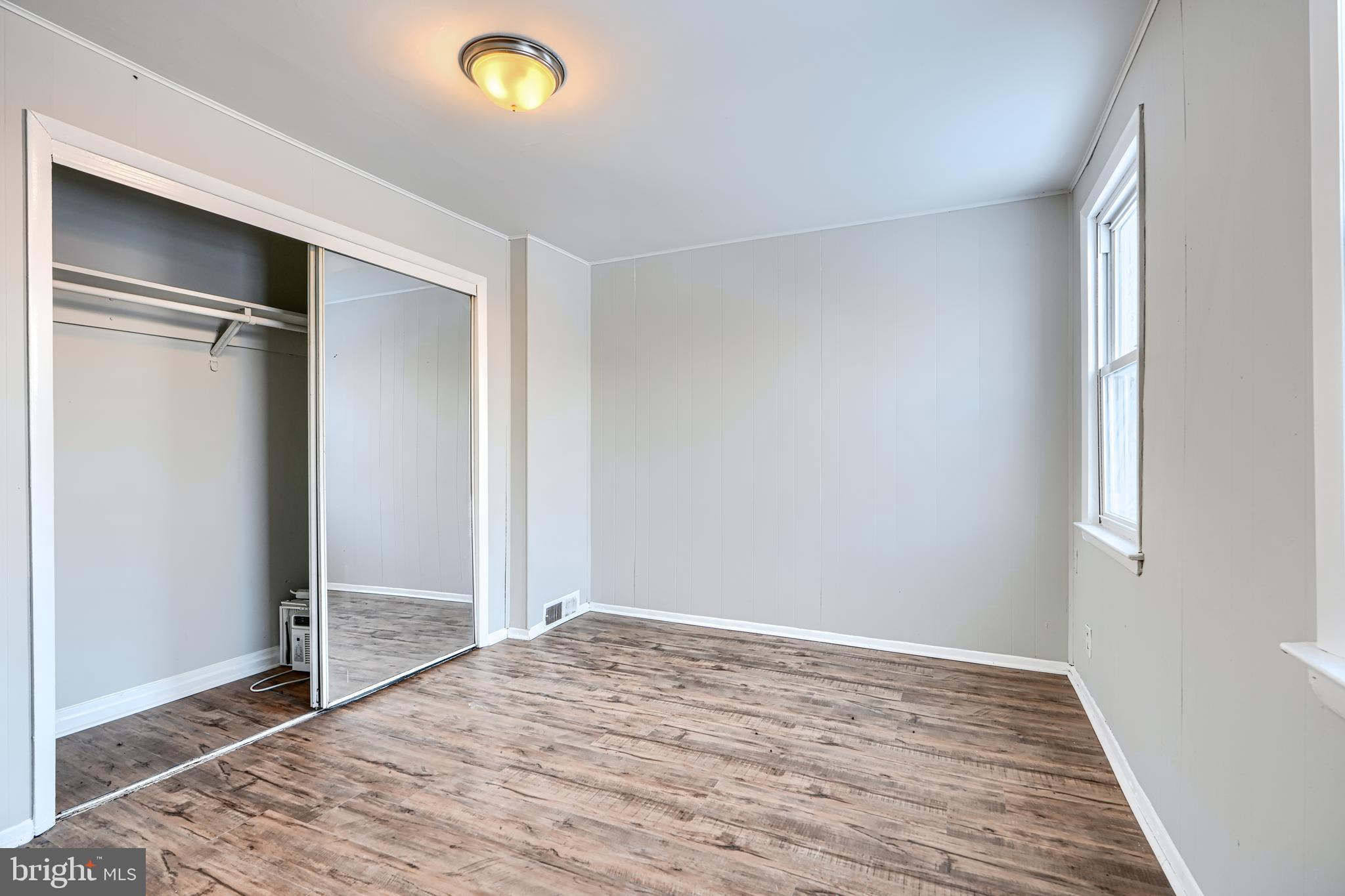 402 Chestnut Court Dundalk, MD 21222 - Photo 10 of 36 a view of empty room with wooden floor