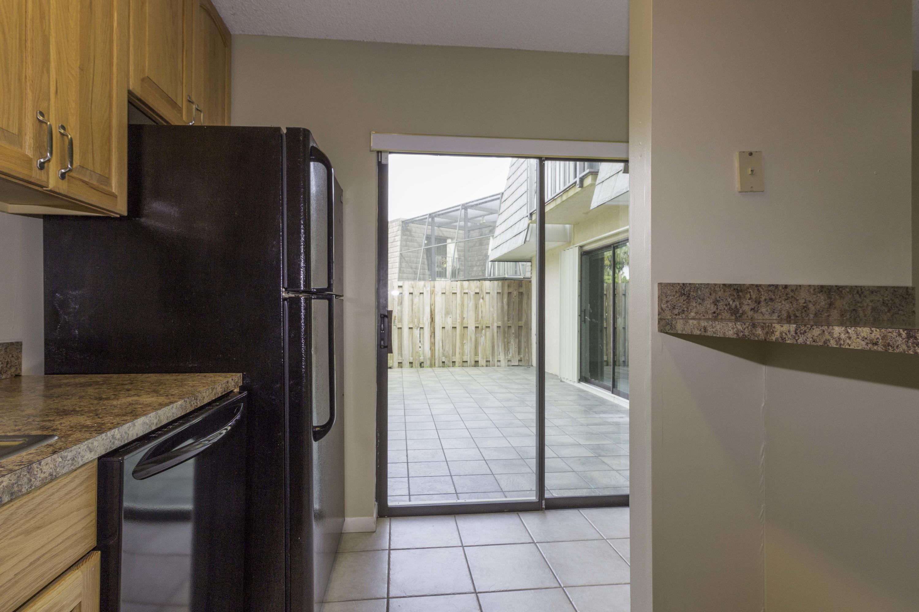 3142 Southeast Brook Street Stuart, FL 34997 - Photo 14 of 32 KitchenPatioView01