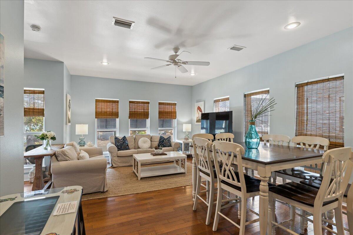 67 Snapper Street Santa Rosa Beach, FL 32459 - Photo 11 of 48 a living room with fireplace furniture and a wooden floor