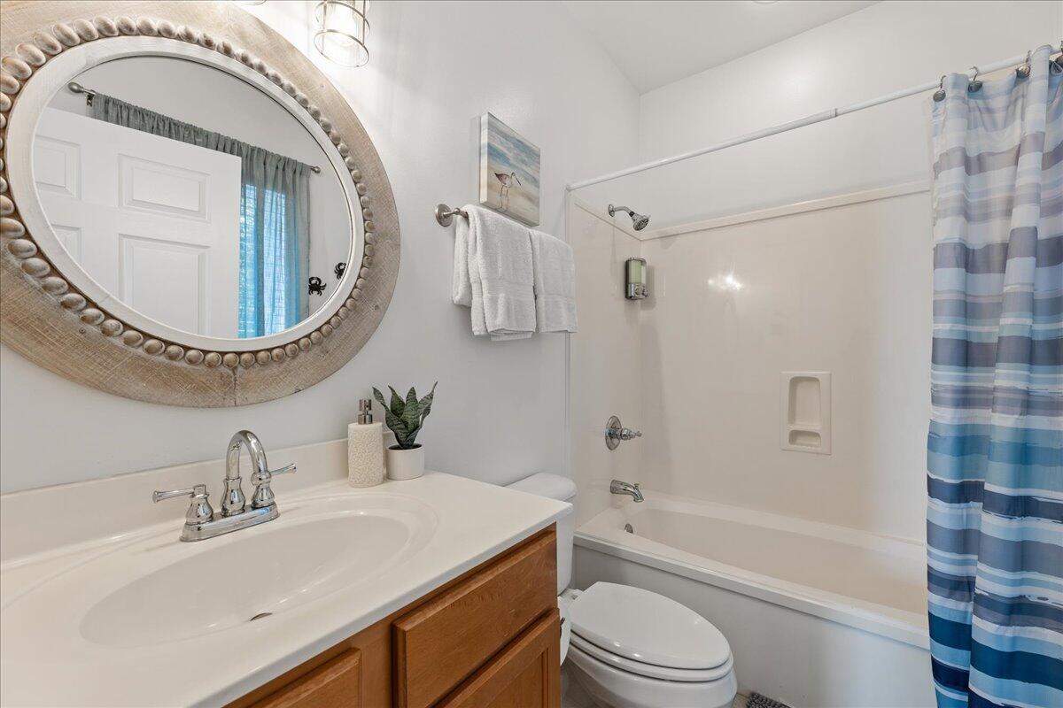 67 Snapper Street Santa Rosa Beach, FL 32459 - Photo 18 of 48 a bathroom with a sink a toilet and a mirror