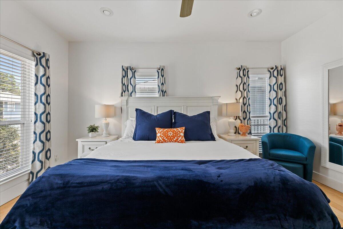 67 Snapper Street Santa Rosa Beach, FL 32459 - Photo 24 of 48 a bedroom with a bed and a chair with the potted plant