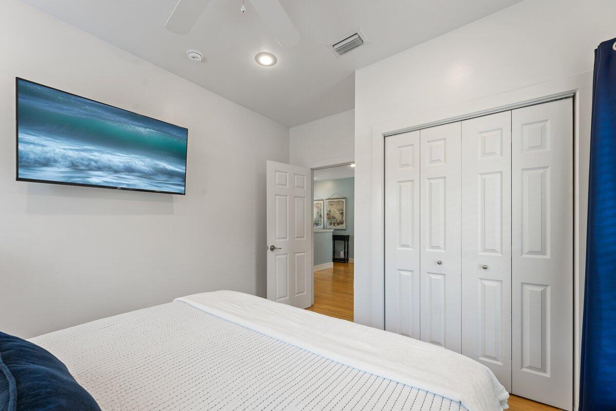 67 Snapper Street Santa Rosa Beach, FL 32459 - Photo 33 of 48 a bedroom with a bed and a painting on the wall