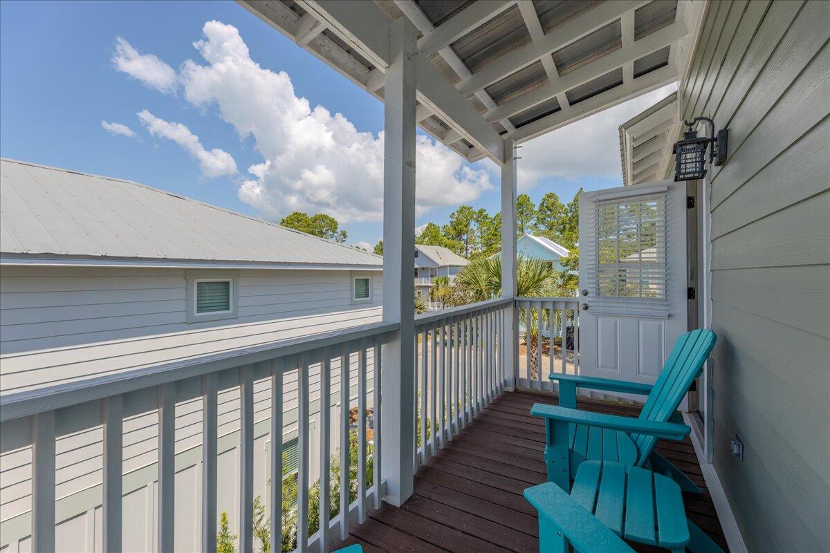 67 Snapper Street Santa Rosa Beach, FL 32459 - Photo 38 of 48 a view of a porch with furniture and a yard
