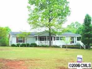 338 Tirzah Church Road Lancaster, SC 29720 - Photo 1 of 8 a front view of a house with a garden