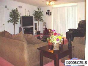 338 Tirzah Church Road Lancaster, SC 29720 - Photo 2 of 8 a dining room with furniture a chandelier and a flat screen tv
