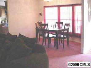 338 Tirzah Church Road Lancaster, SC 29720 - Photo 3 of 8 a dining room with furniture and a floor to ceiling window