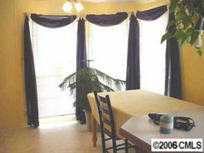 338 Tirzah Church Road Lancaster, SC 29720 - Photo 5 of 8 a balcony with table and chairs