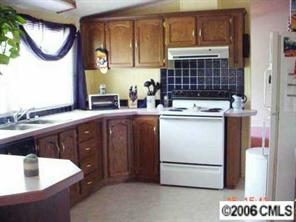338 Tirzah Church Road Lancaster, SC 29720 - Photo 8 of 8 a kitchen with a sink and a stove top oven
