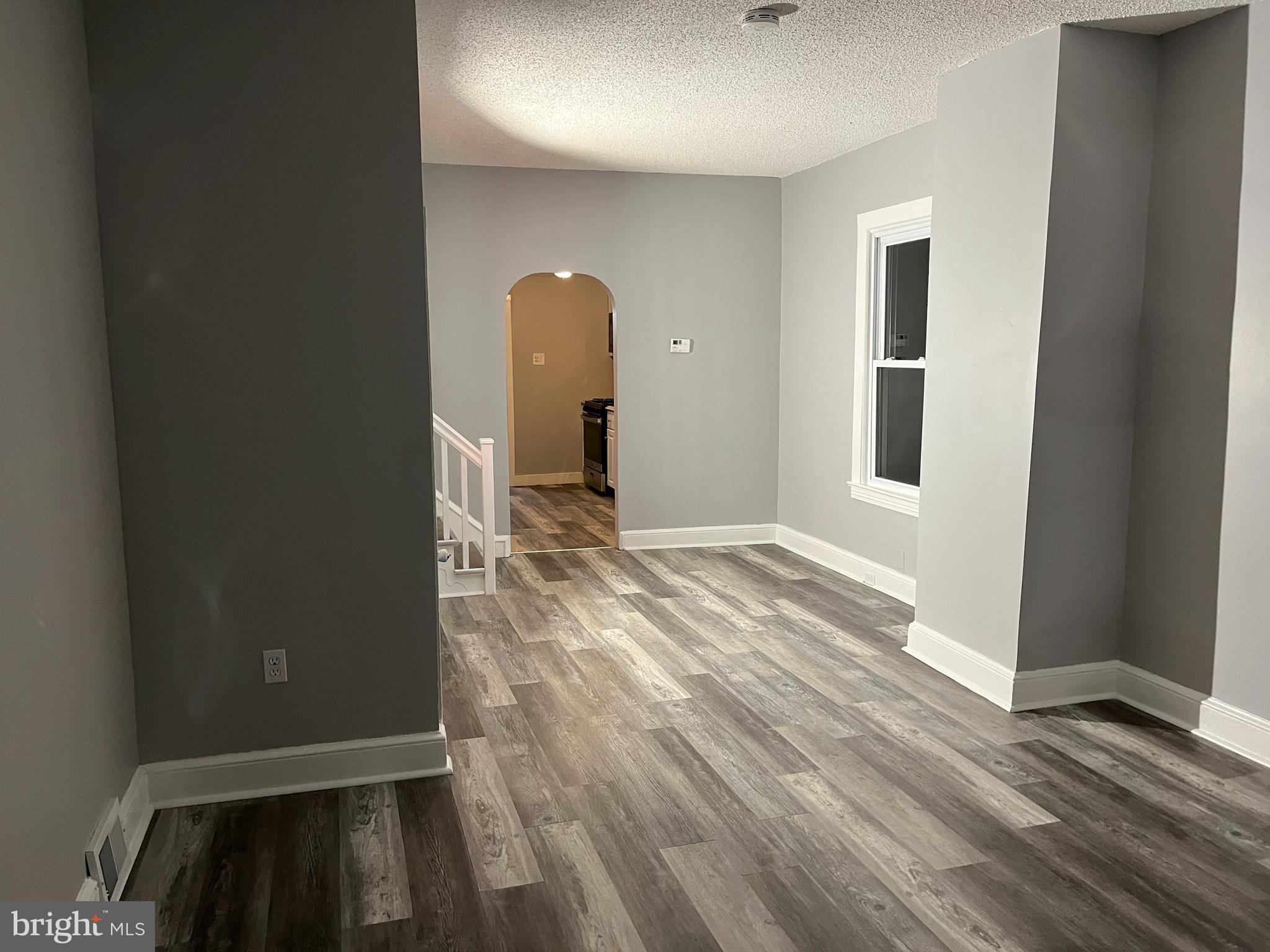262 Crown Point Road, Unit A Thorofare, NJ 08086 - Photo 2 of 7 wooden floor in an empty room with a window