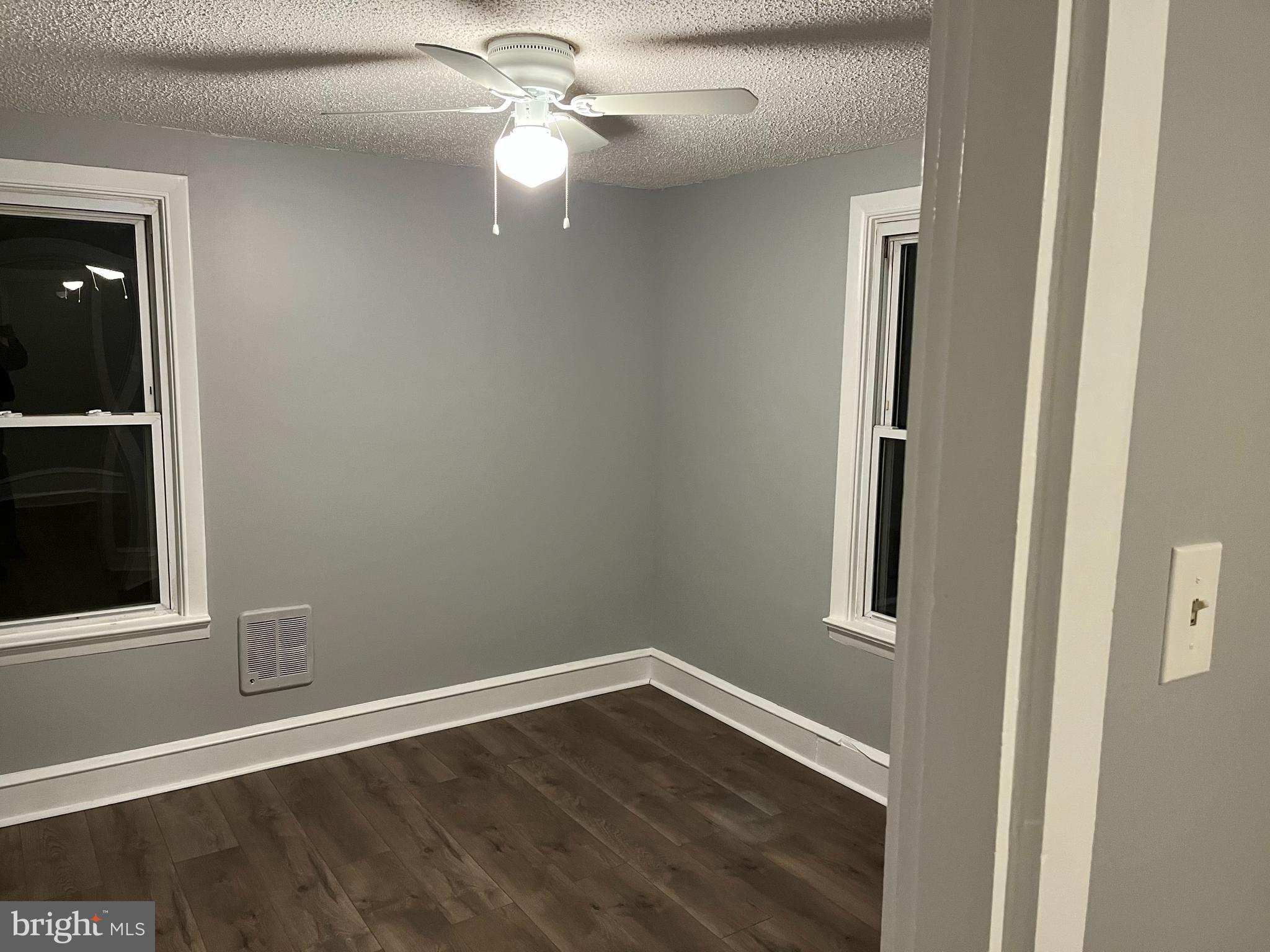 262 Crown Point Road, Unit A Thorofare, NJ 08086 - Photo 7 of 7 an empty room with wooden floor closet and windows