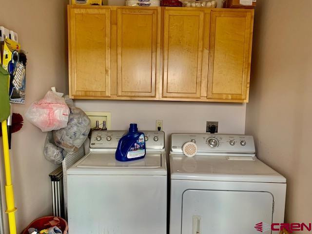 22989 Rd G.5 Cortez, CO 81321 - Photo 18 of 27 a bathroom with a sink and a washer dryer
