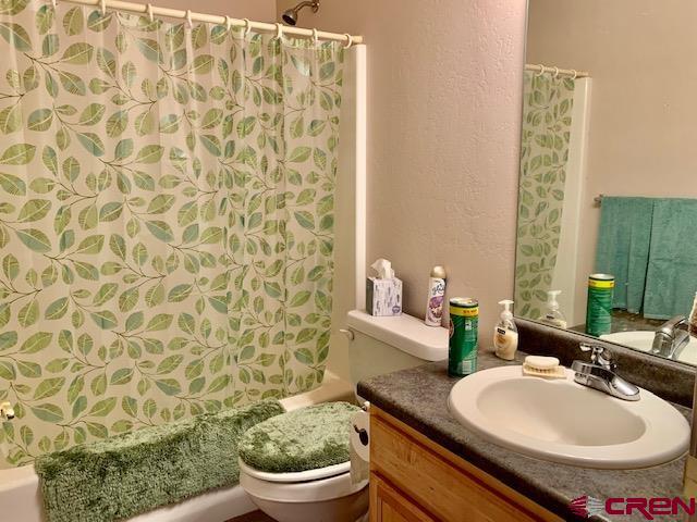 22989 Rd G.5 Cortez, CO 81321 - Photo 21 of 27 a bathroom with a sink toilet and a mirror