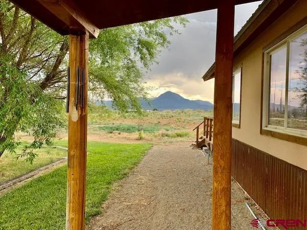 a view of a yard with an outdoor space