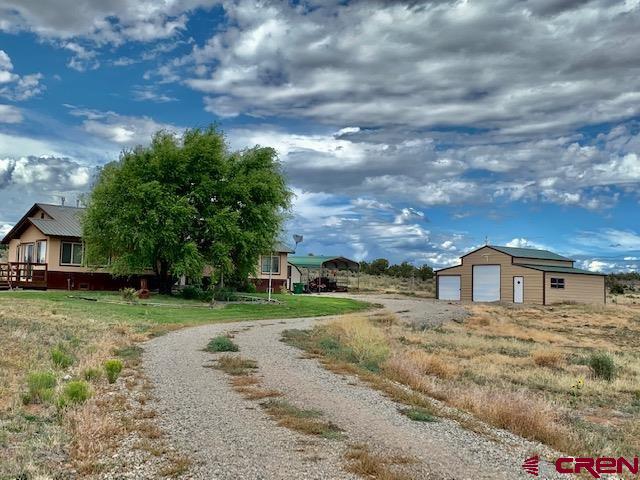 22989 Rd G.5 Cortez, CO 81321 - Photo 9 of 27 a view of house with outdoor space
