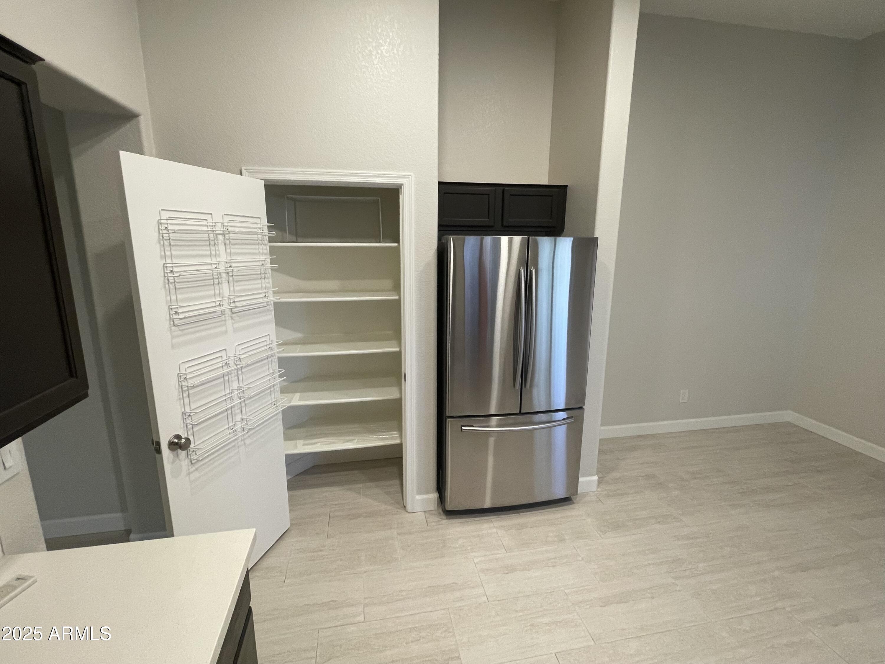 3803 West Commonwealth Avenue Chandler, AZ 85226 - Photo 4 of 15 a view of walk in closet with empty racks