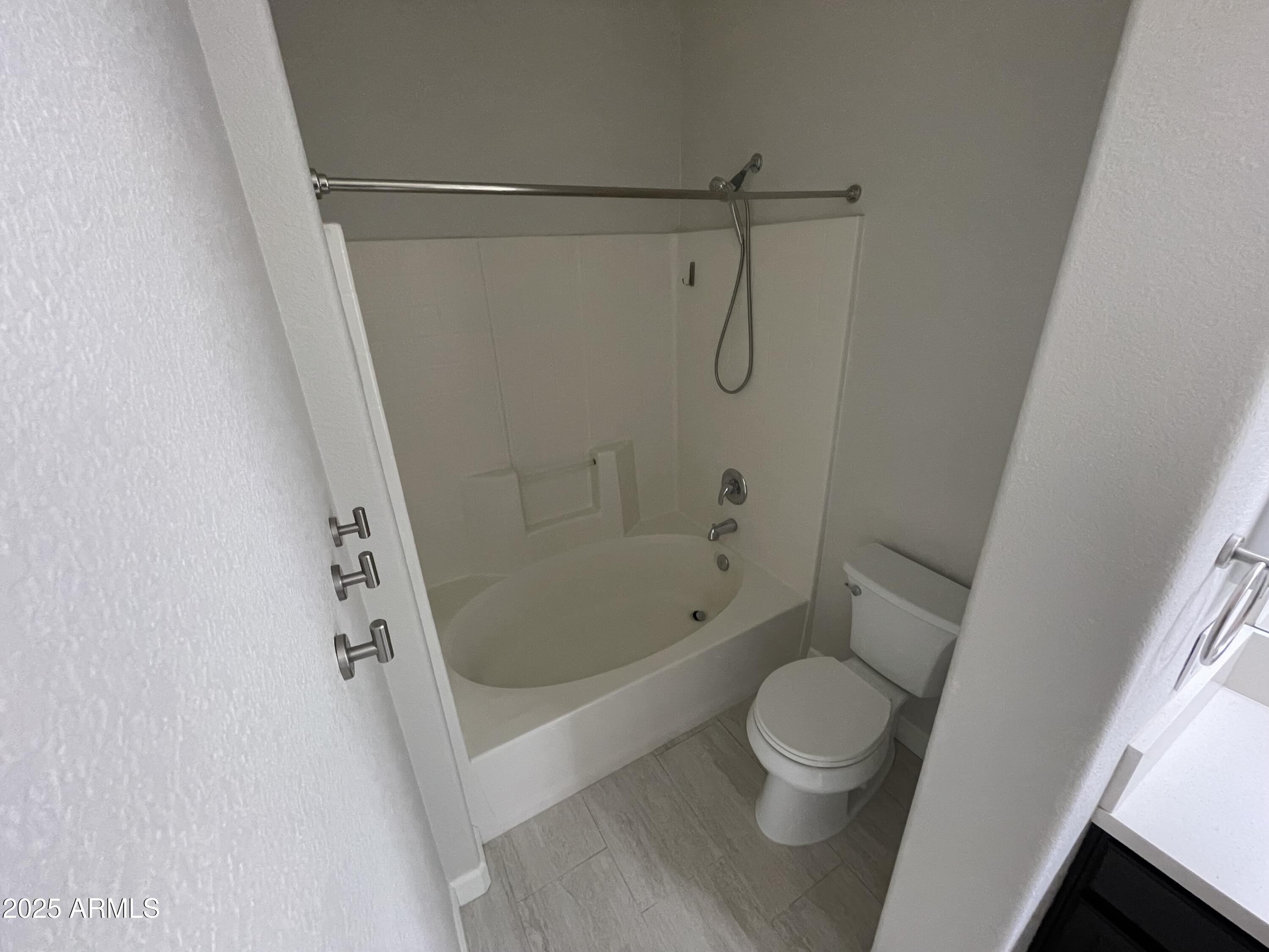 3803 West Commonwealth Avenue Chandler, AZ 85226 - Photo 10 of 15 a bathroom with a shower and a toilet