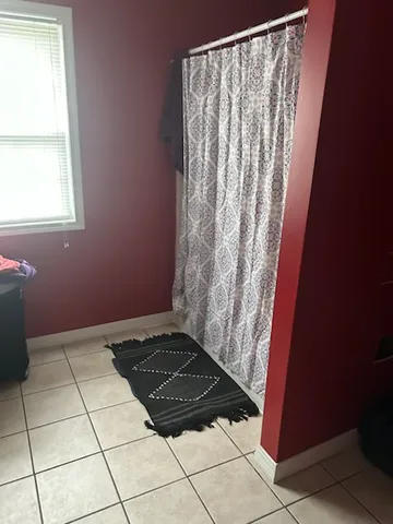 a view of a utility room with windows