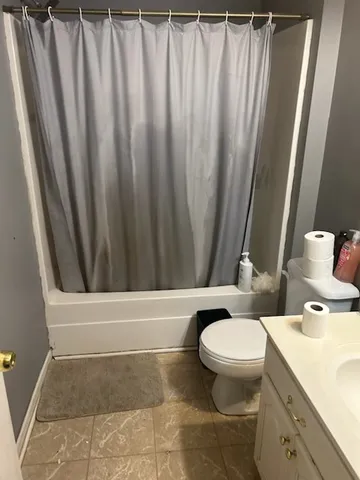 a bathroom with a toilet and a sink