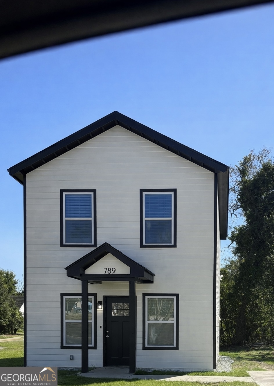 a front view of a house with garage