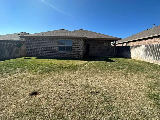a house with yard in front of it