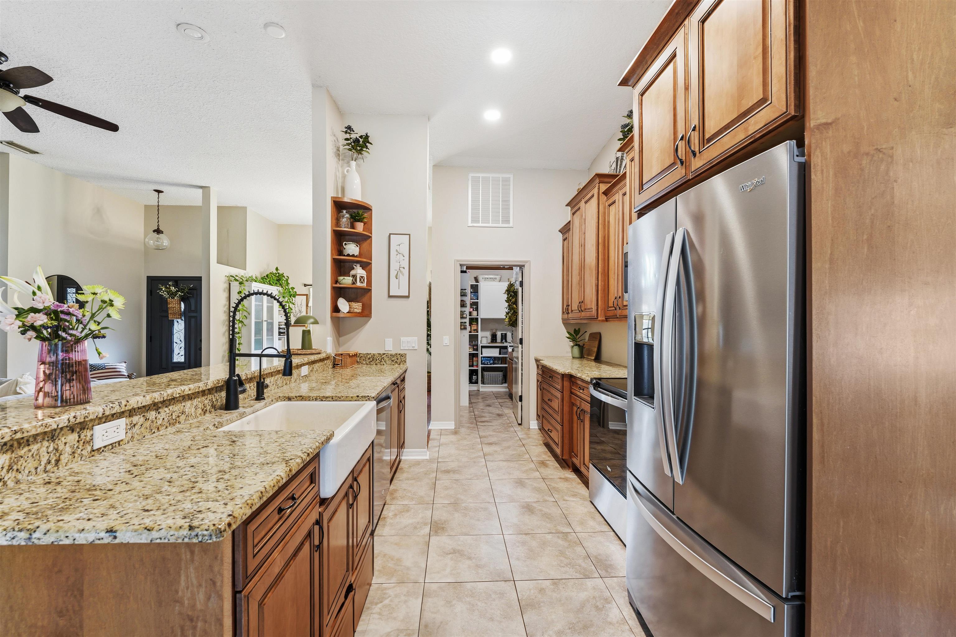 1805 Bennett Road St. Augustine, FL 32092 - Photo 12 of 65 a kitchen with stainless steel appliances granite countertop a refrigerator and a sink