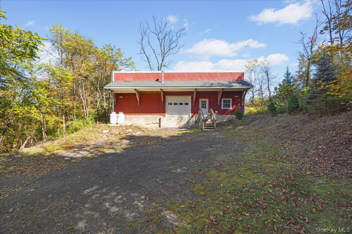 1-3 Amdurer Road Westtown, NY 10998 - Photo 13 of 48 a front view of a house with a yard and garage
