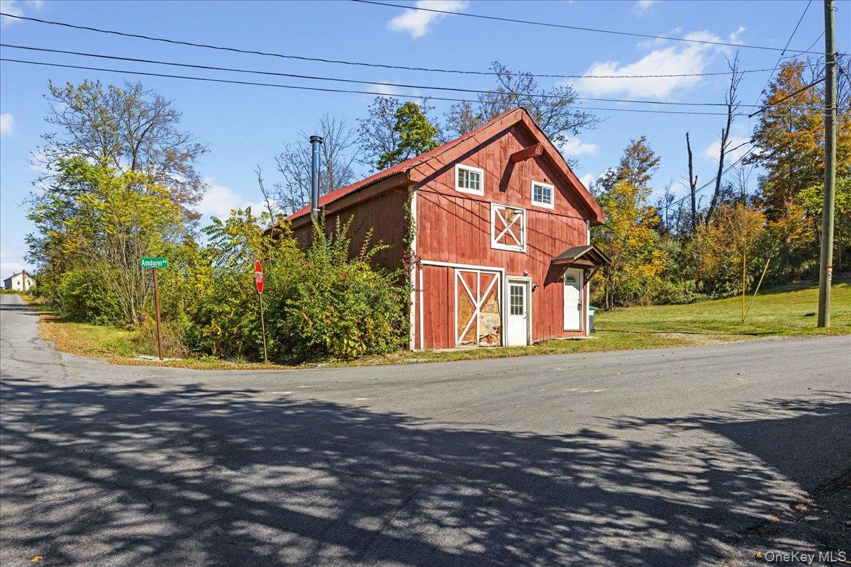 1-3 Amdurer Road Westtown, NY 10998 - Photo 20 of 48 a front view of a house with a yard and garage