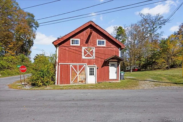 a view of a house with a yard and garage