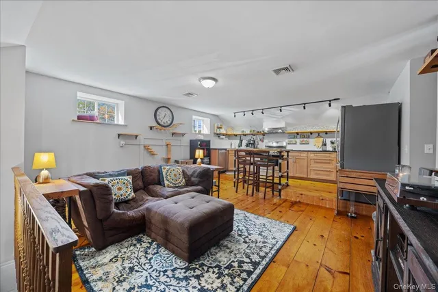 a living room with furniture and a rug